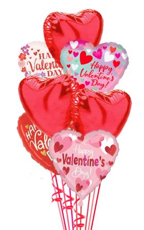 Valentine’s Day balloon bouquet with 18-inch heart-shaped mylar balloons in pink and red shades, arranged on a pink weight