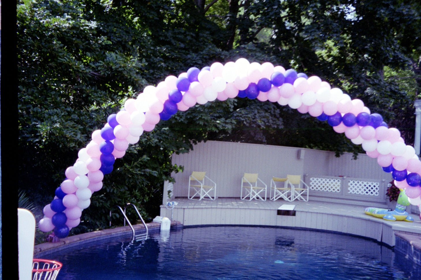 10 FT spiral balloon arch with vibrant multicolor four-cluster design for parties and events