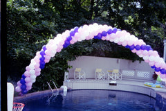 10 FT spiral balloon arch with vibrant multicolor four-cluster design for parties and events