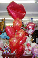 Valentine’s Day balloon bouquet with 26 Inch mylar lips, heart mylars, latex balloons, and 1lb Hershey Kisses