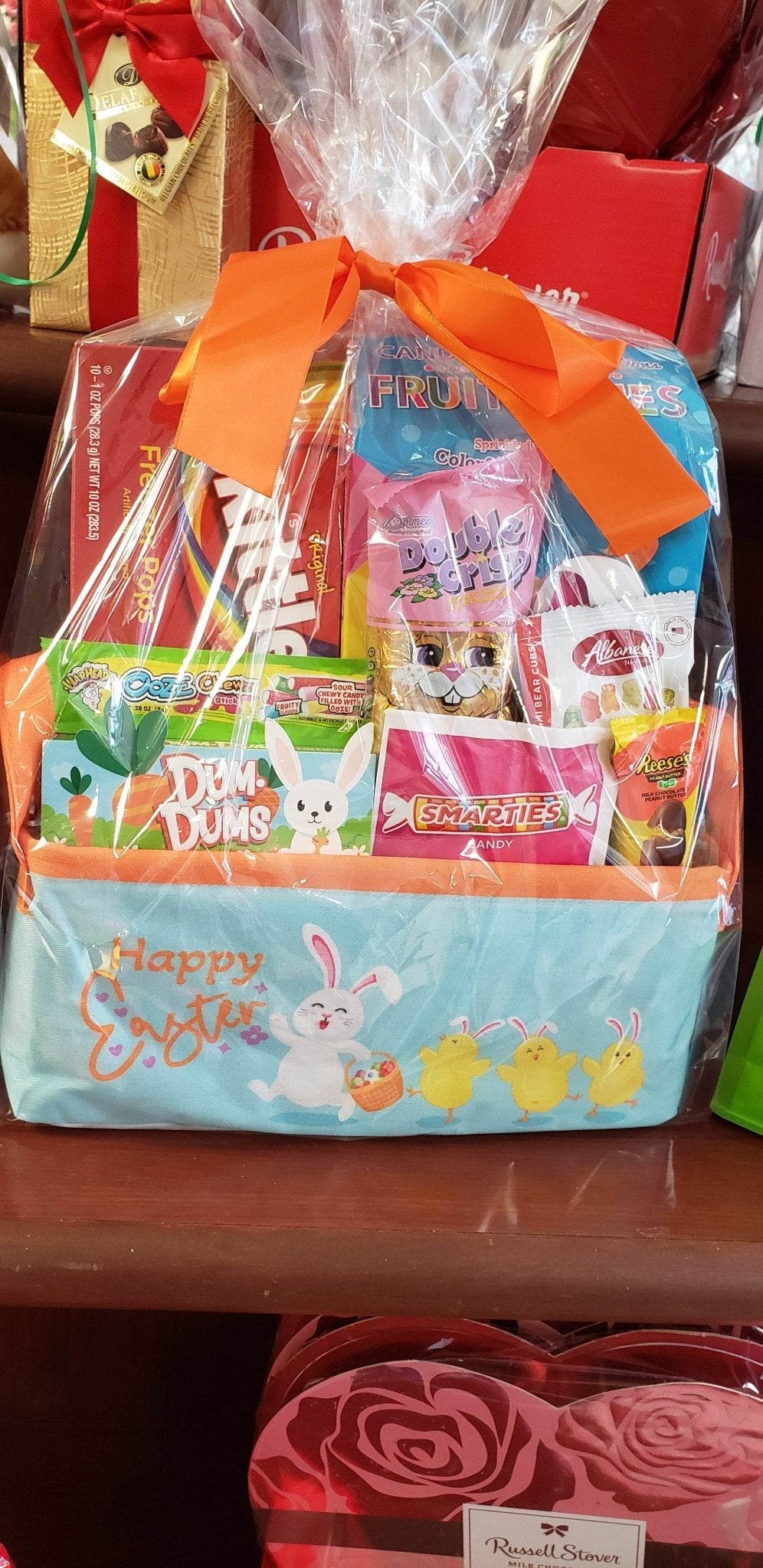 Easter Canvas Gift Tote filled with chocolate bunny, Skittles, Smarties, and lollipops